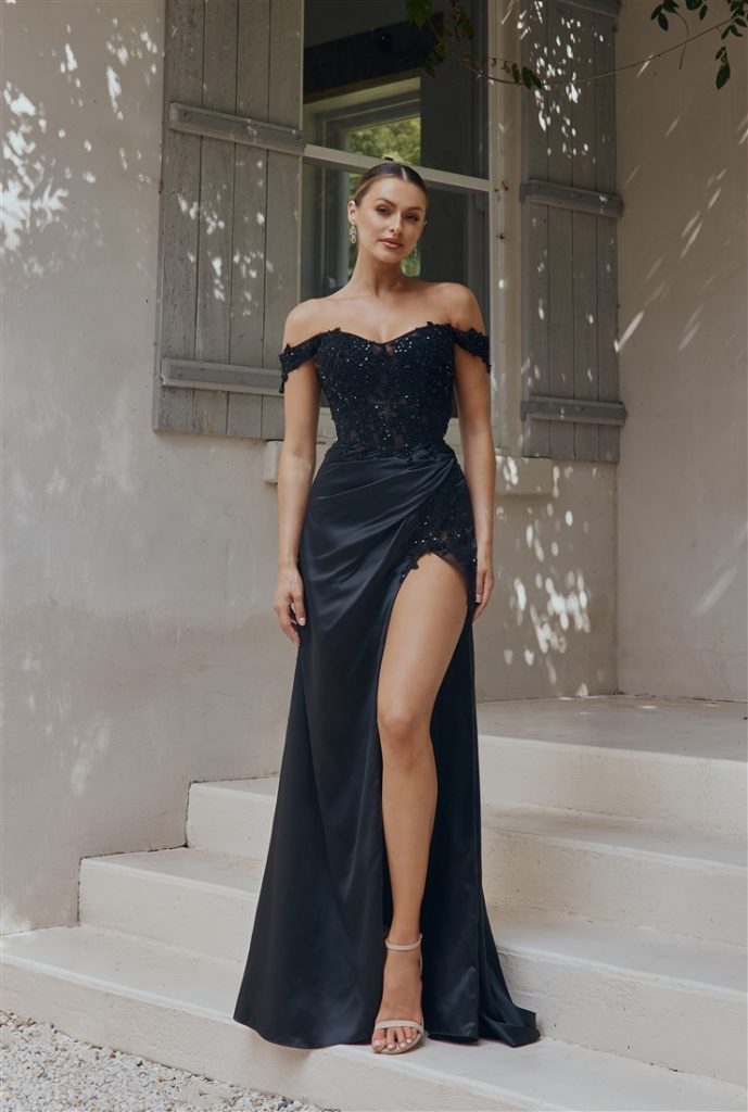 Fitted black prom dress in satin with lace and beadwork to the bodice and hip